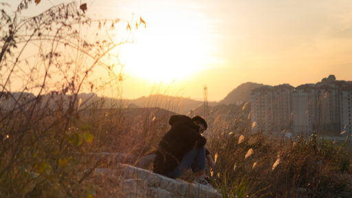 Caches From the Landscape - photo of a youngster on a hill